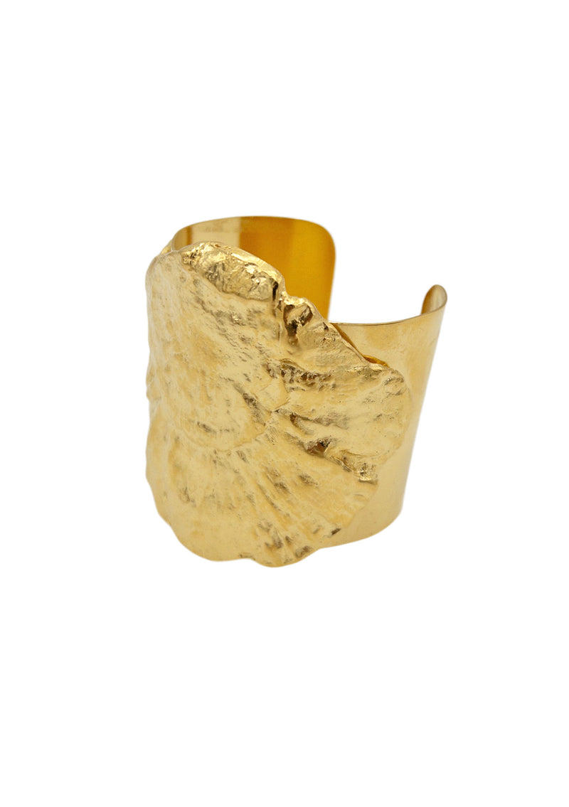 This one-of-a-kind gold statement cuff bracelet will make a bold impression with its impressive size and intricate carved top. Let its luxurious sheen and intricate design add a touch of sophistication to your look with effortless elegance. A bohemian fall cuff bracelet