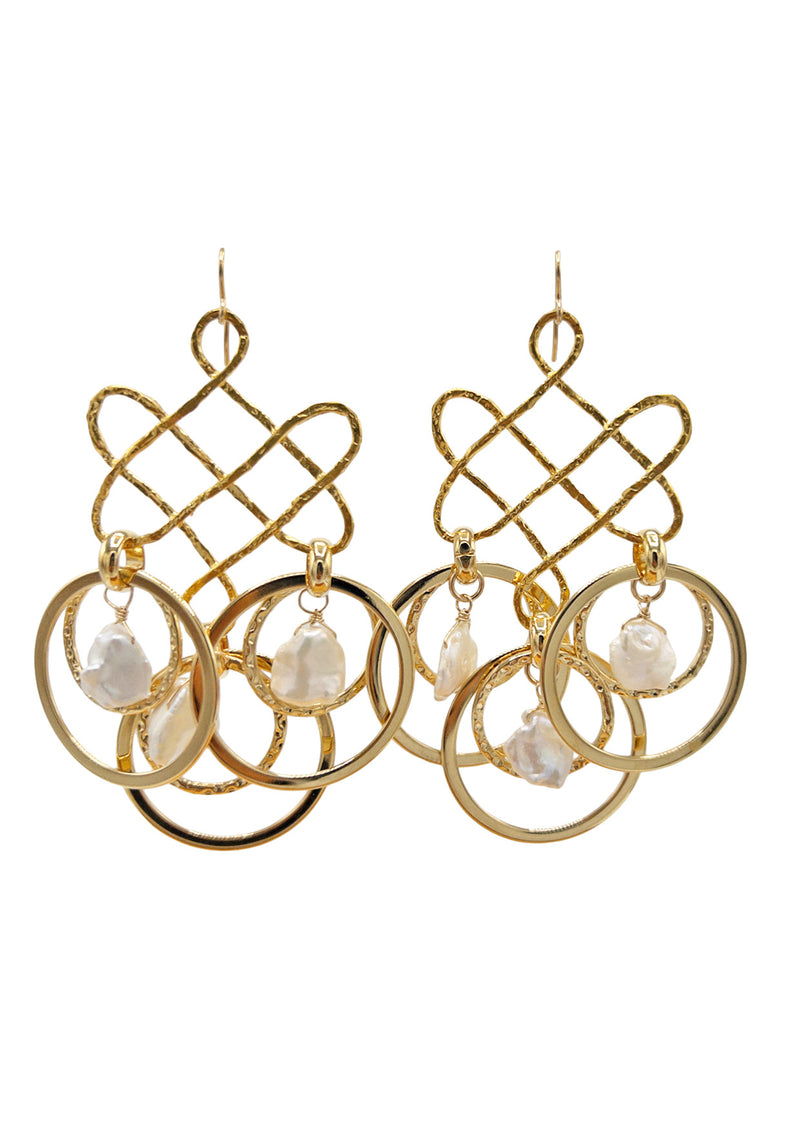 Jewelry made for a high end beach photoshoot. Photo of incredible Freshwater Pearl Gold Trellis Statement Earrings. With 3 freshwater pearl nuggets dangling from each trellis earring, take these beautiful earrings on your next resort getaway or beach photoshoot.