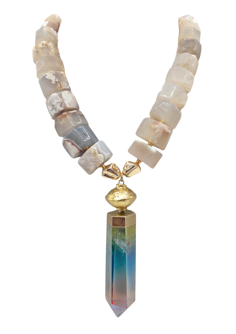 Oversized statement bohemian necklace featuring a large Rainbow Crystal Quartz Pendant and large, authentic agate beads. Make a genuine statement with this extremely unique conversation staring bohemian necklace. Handcrafted in the USA by luxury jewelry designer Devon Leigh.