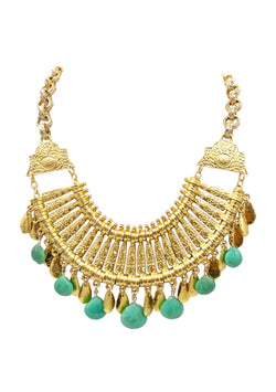This exotic Chrysoprase Gold Goddess Necklace features an intricate gold chest plate adorned with captivating green chrysoprase nuggets, sure to make a grand bohemian statement. Perfect for adding a touch of luxury and sophistication to any look, it's an exquisite and unique accessory that will make you feel like the goddess you are.