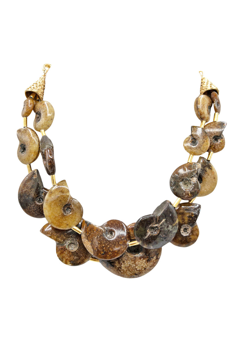 Like nothing you've ever seen, this one-of-a-kind fossilized ammonite multi-strand necklace was designed to bring ancient energy into your everyday styling. The varying browns and deep neutrals make this ultra bohemian statement necklace perfect for fall styling.