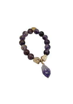 This beautiful Super Seven Gold Amethyst Stretchy Bracelet is perfect for adding a hint of sophistication and bohemian flair to any outfit. With its elegant gold and breathtaking purple amethyst, you'll be sure to make a statement.
